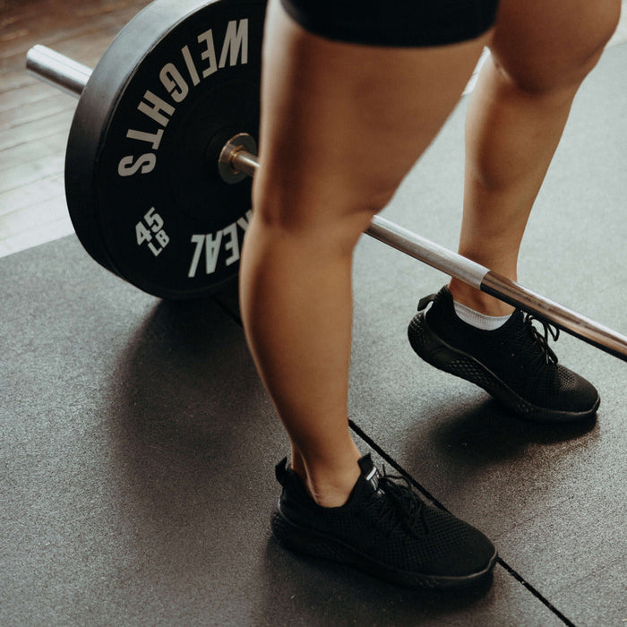 woman stretching calf